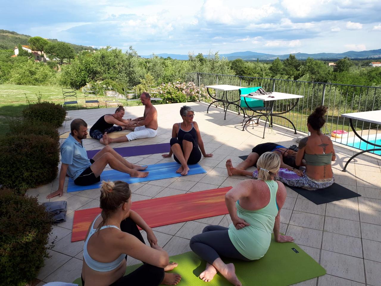 Group seated circle by the pool